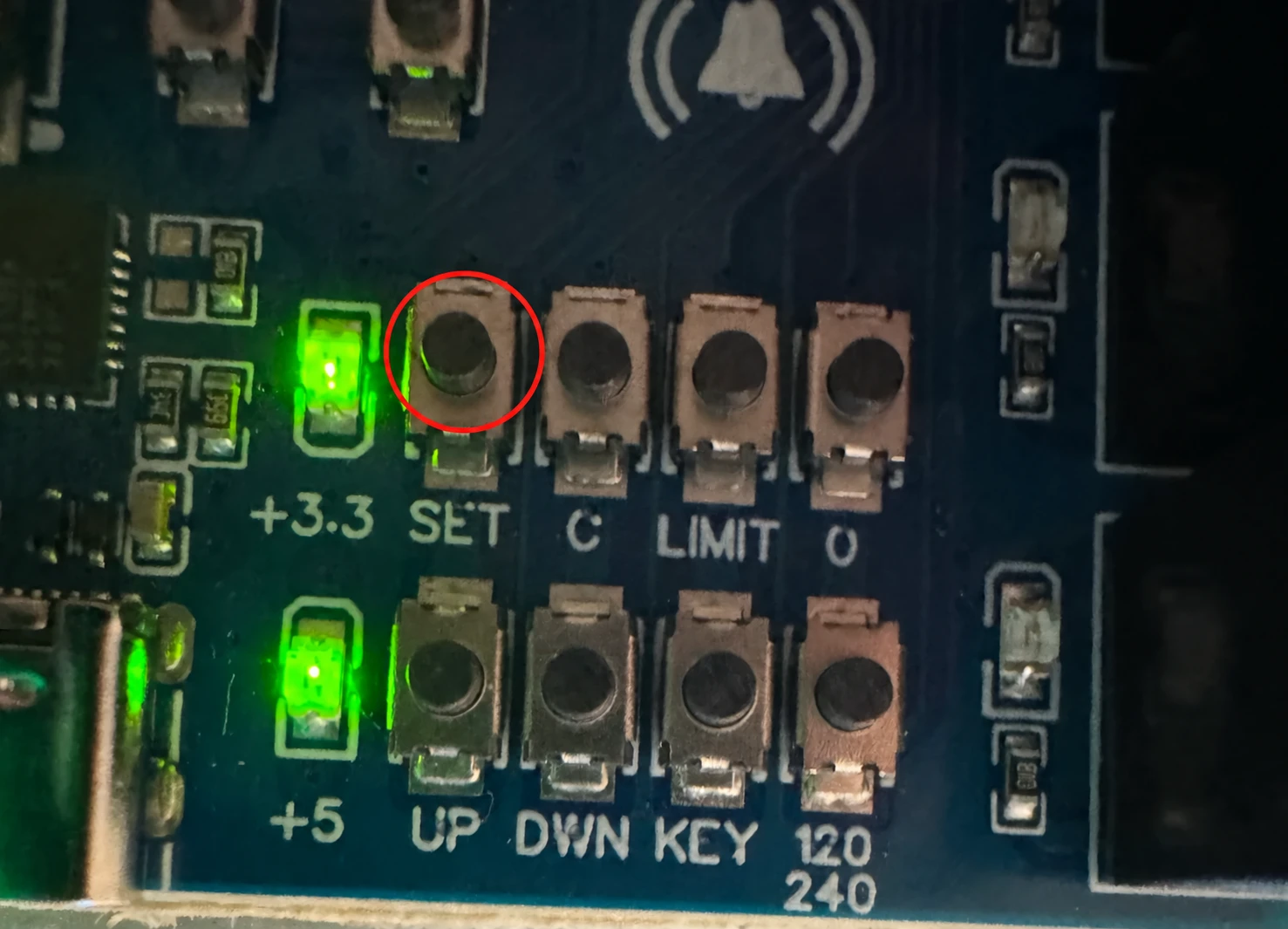 SET, the first button in the top row, circled in red